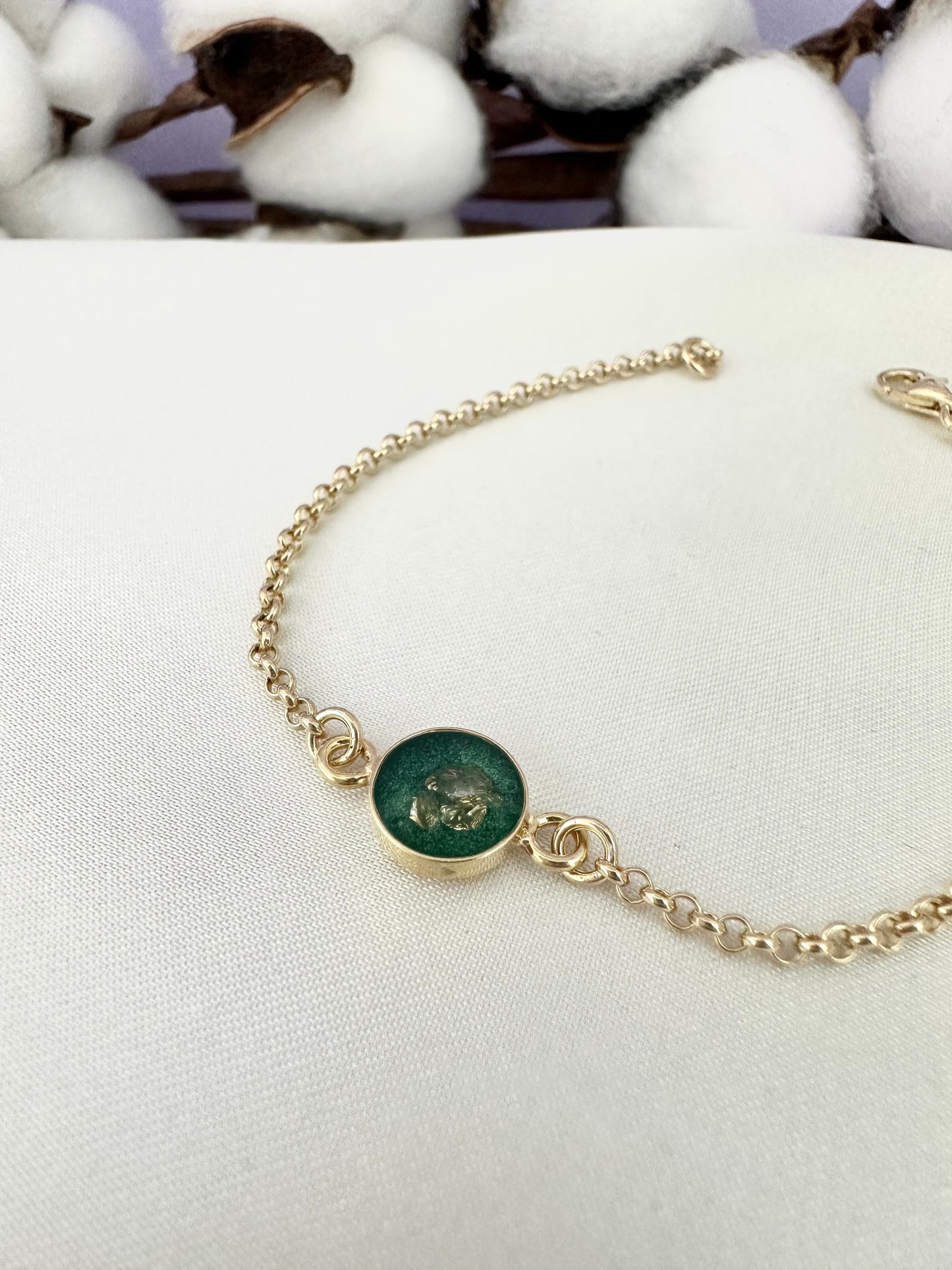 Bracelet with dark green pendant and golden stones